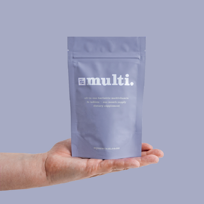 Multi 2.0 all-in-one bariatric multivitamin pouch held in an open hand